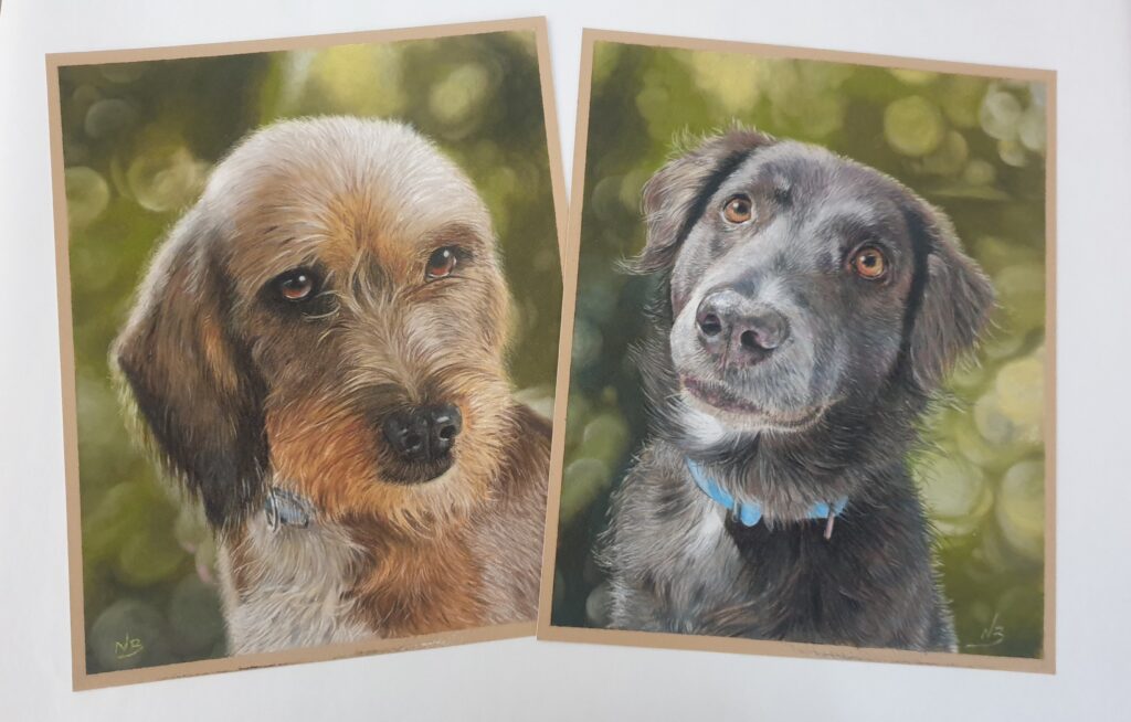 Two finished custom pet portraits of dogs by nic beese